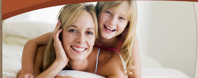 woman and young girl smiling